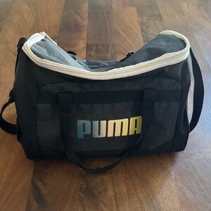 Puma Black and Gray Kids Duffel with Blue-to-Yellow Gradient Logo